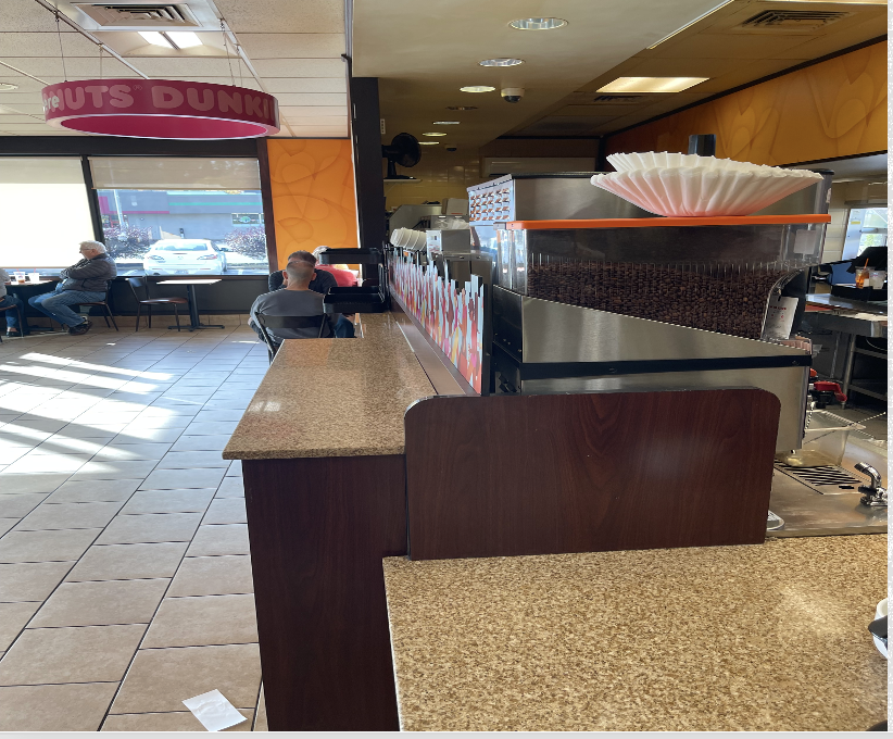 Wide angle view of the inside of Dunkin'Donuts taken from the counter.